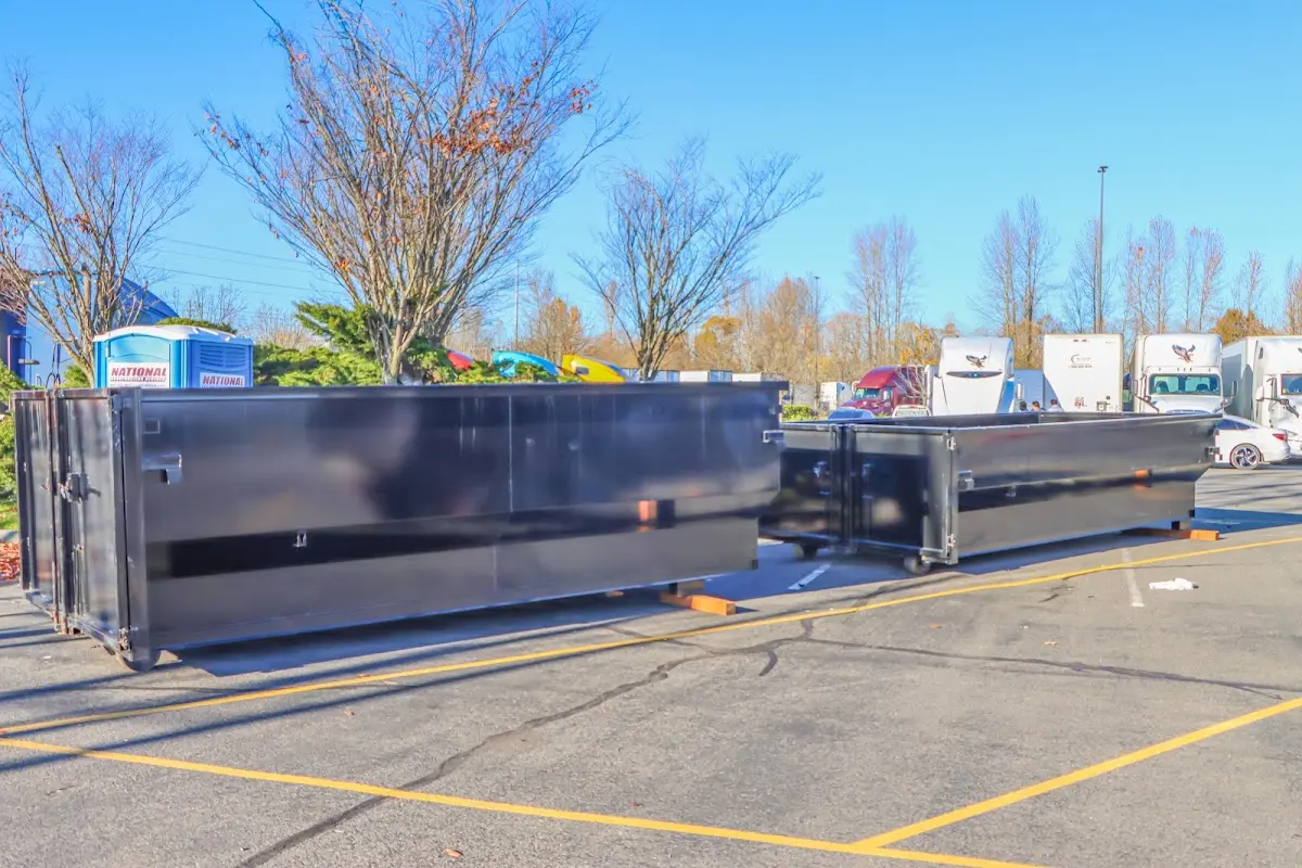 Professional dumpster rental service with roll-off container on residential driveway in Marion Oaks